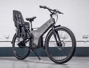 ETT electric bike with a rear child seat fitted, in the Moon Bike Rentals workshop